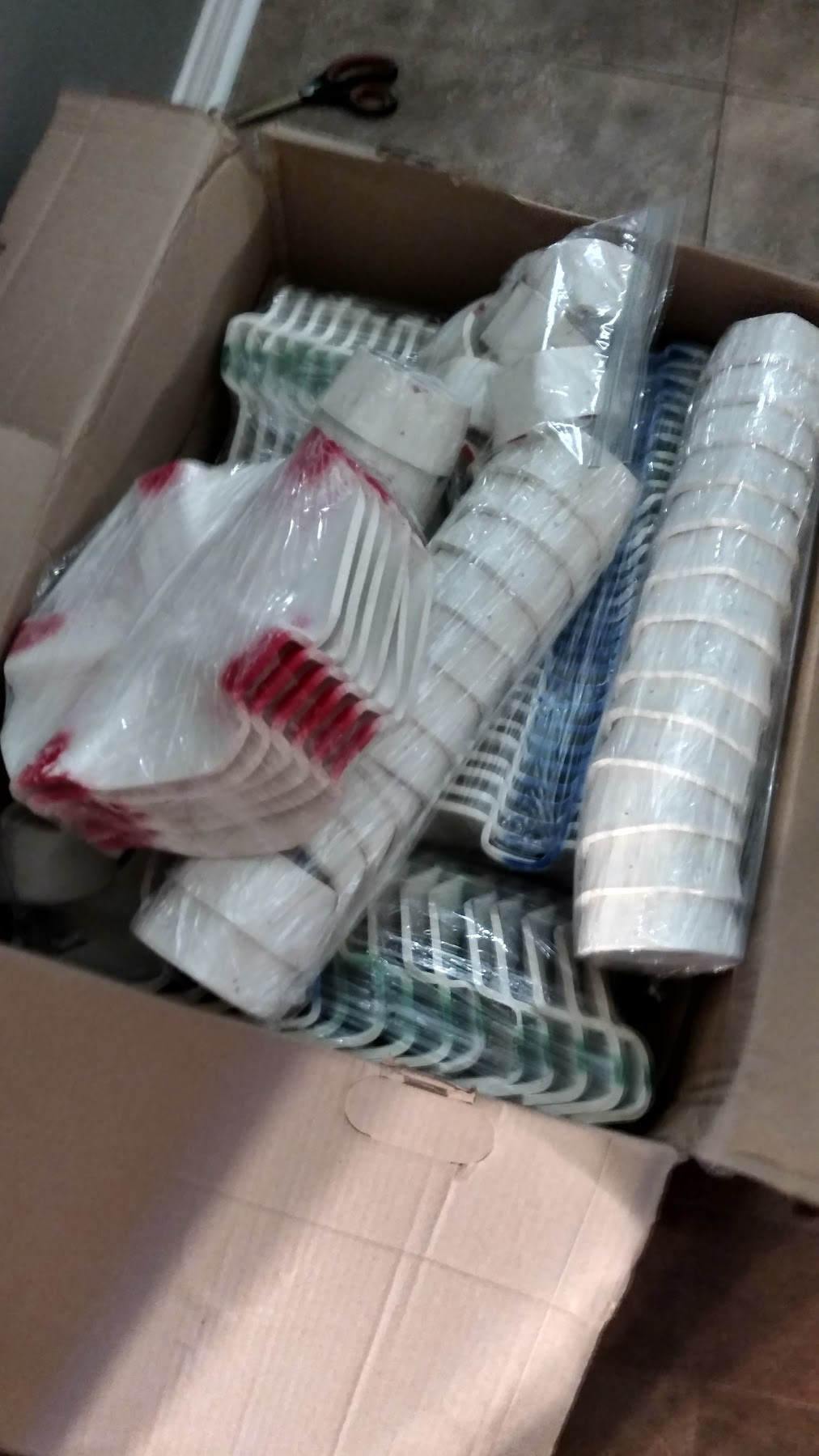 The original PVC hub kit in its box: color-coded scalloped discs and stacked center sockets